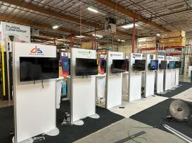 RENTAL: (9) RE-1212 Tapered Counter Kiosks with RE-1201 White Laminated Counters, Monitor Mounts, and Baseplates, Direct Print Sintra Wing Graphics, (9) Double-Sided 30" x 72" Gravitee Kiosks, Monitor Mounts, Direct Print Sintra Graphics, (27) 32" Monitor