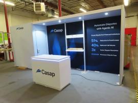 Custom Gravitee Modular Inline with Fabric Graphics, Storage Closet, Shelving, Puck Lights, Monitor Mounts, and MOD-1596 Reception Counter with Storage